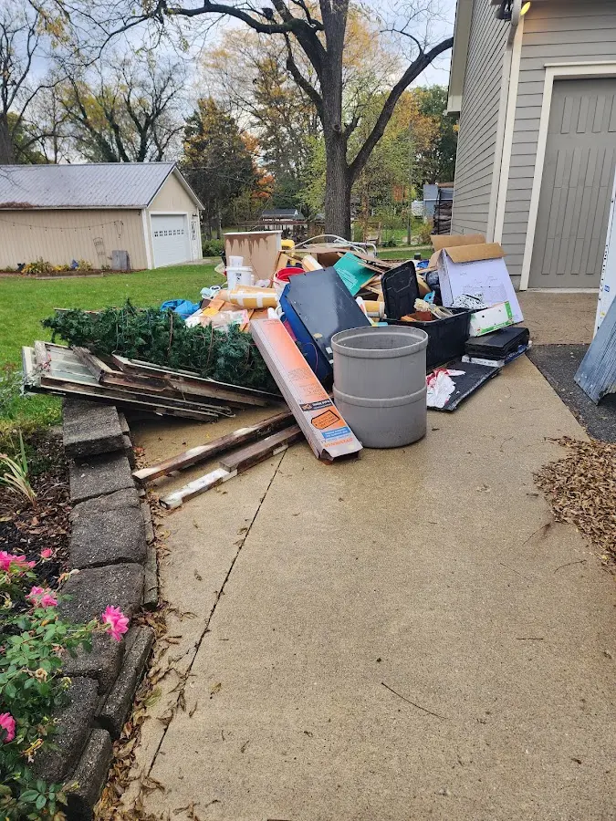 Dumpster being loaded with debris for Residential Dumpster Rental in Byron